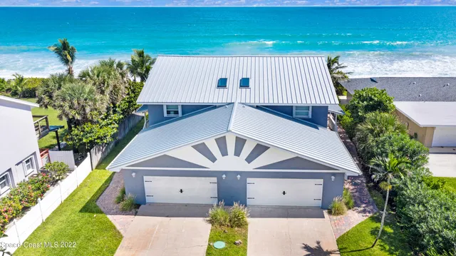 an aerial view of a house with a garden