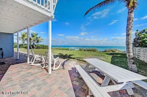 a bedroom with bed and a flat tv screen on dresser