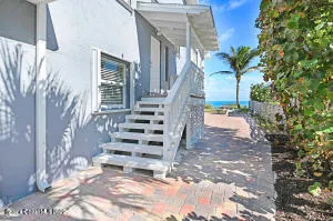 a bathroom with a granite countertop sink a toilet and a mirror