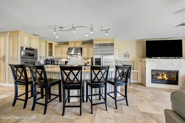 a bedroom with bed and a chandelier