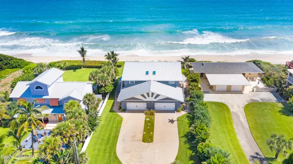 an aerial view of a house with a garden
