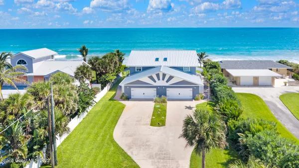 an aerial view of a house with a garden