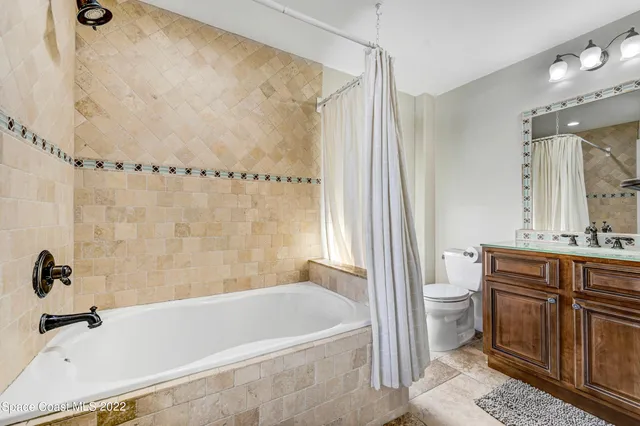 a spacious bathroom with a double vanity sink double and a mirror