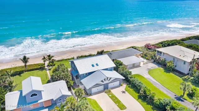 an aerial view of a house with a garden