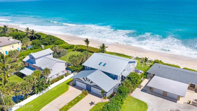 a aerial view of a house with a garden and plants
