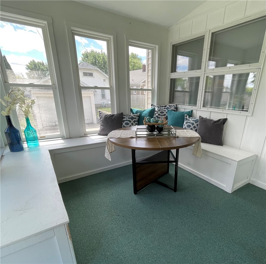 360 Ridge Street Piqua, OH 45356 - Photo 31 of 46 This bright sunroom offers a cozy dining nook, perfect for relaxed meals and abundant natural light.