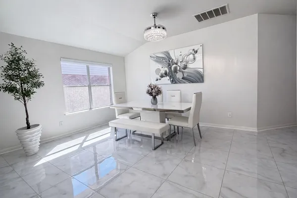 a kitchen with stainless steel appliances kitchen island a sink a stove and cabinets