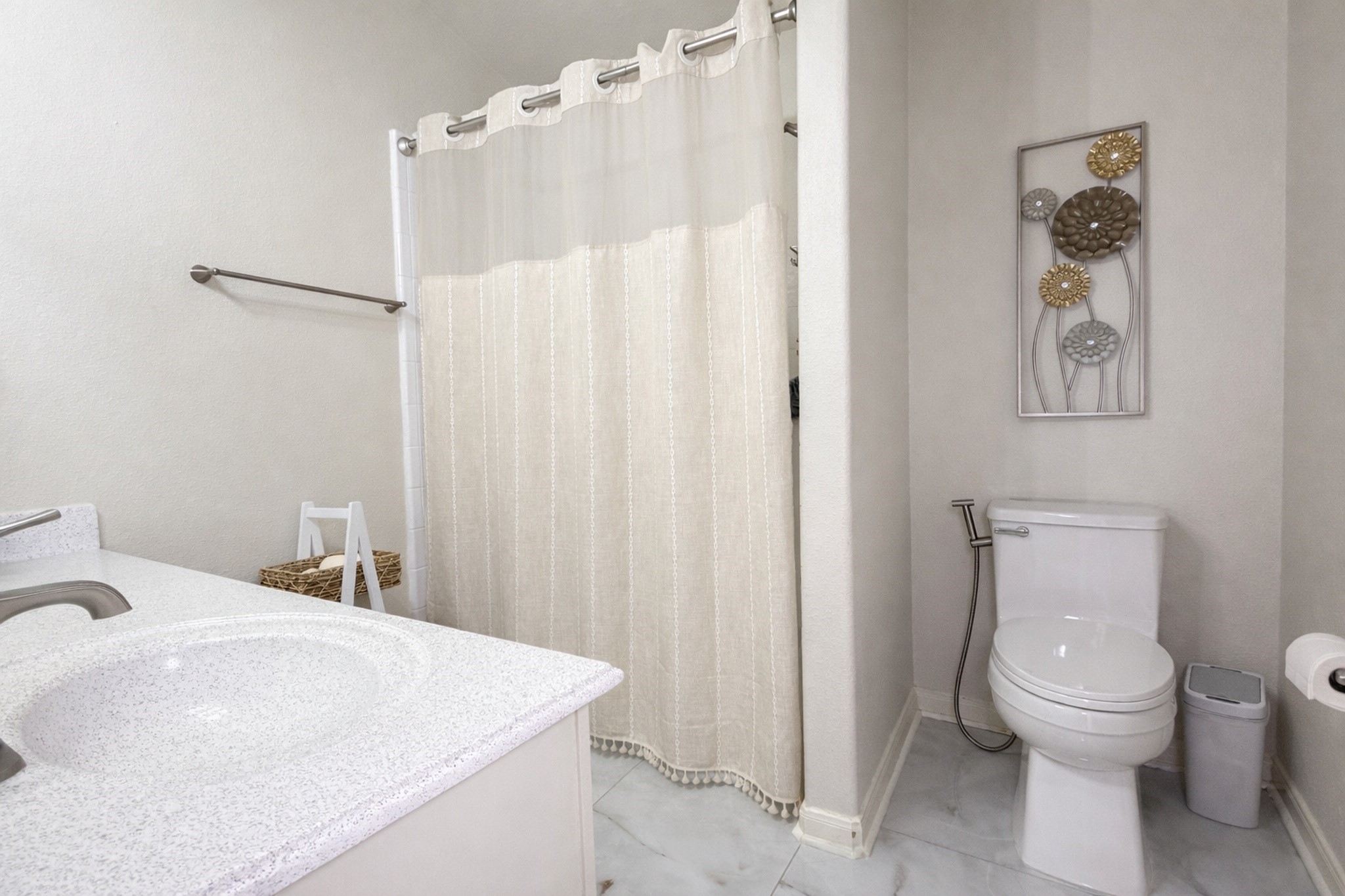 24534 Forest Path Court Spring, TX 77373 - Photo 26 of 43 a white toilet sitting next to a bathroom sink