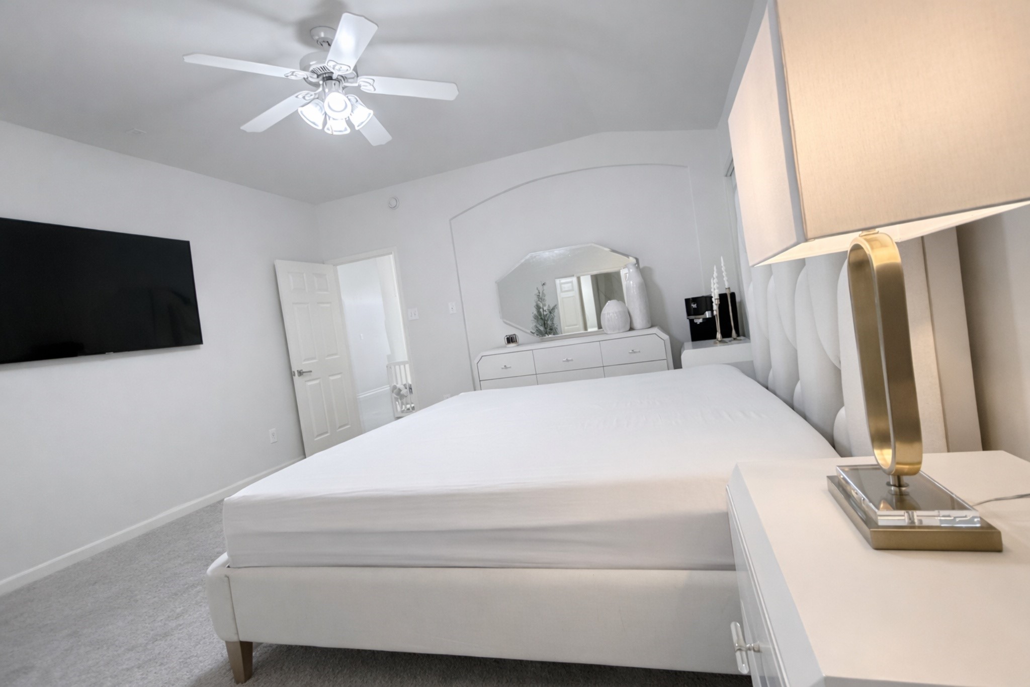 24534 Forest Path Court Spring, TX 77373 - Photo 28 of 43 a spacious bedroom with a bed and a flat screen tv