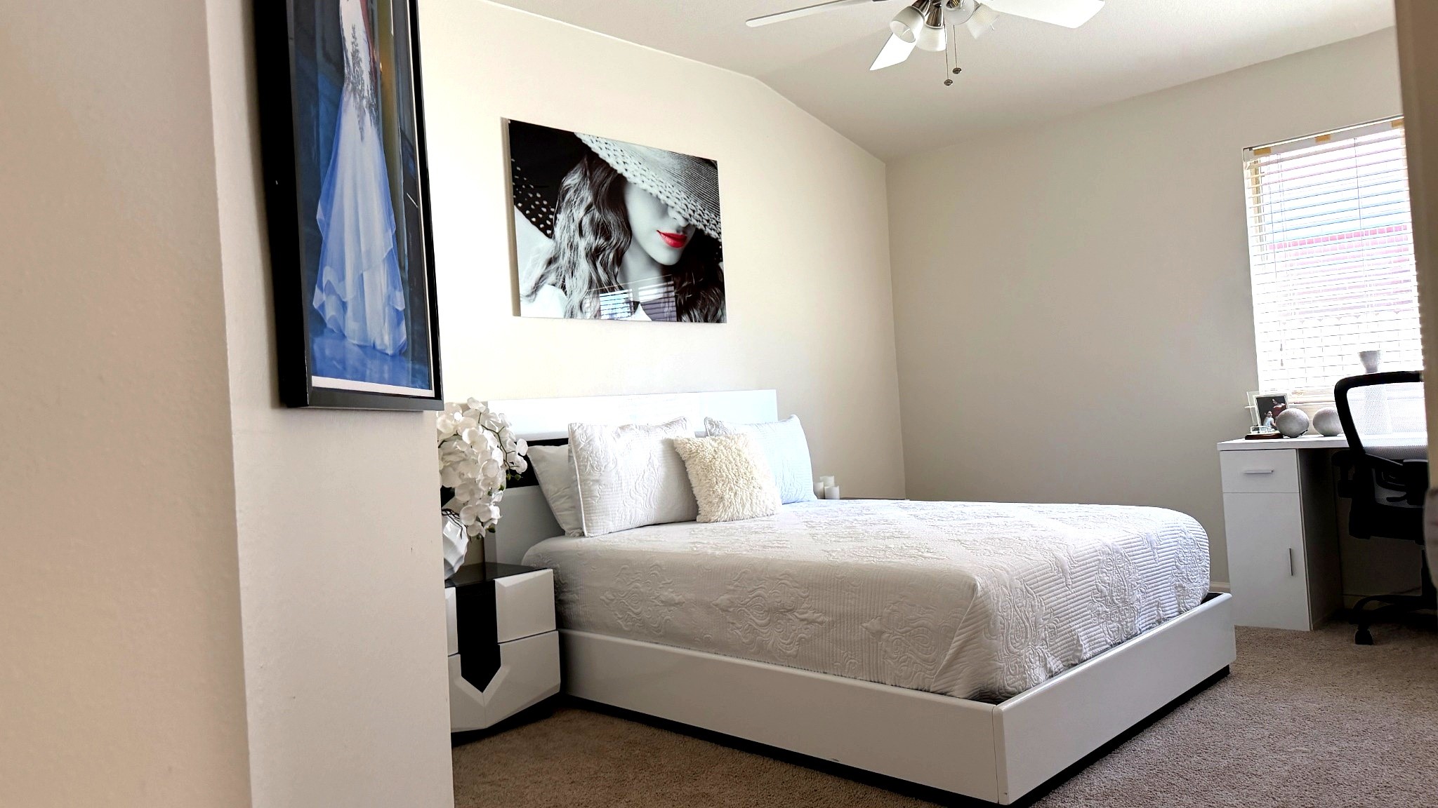 24534 Forest Path Court Spring, TX 77373 - Photo 29 of 43 a bedroom with a bed and a chandelier