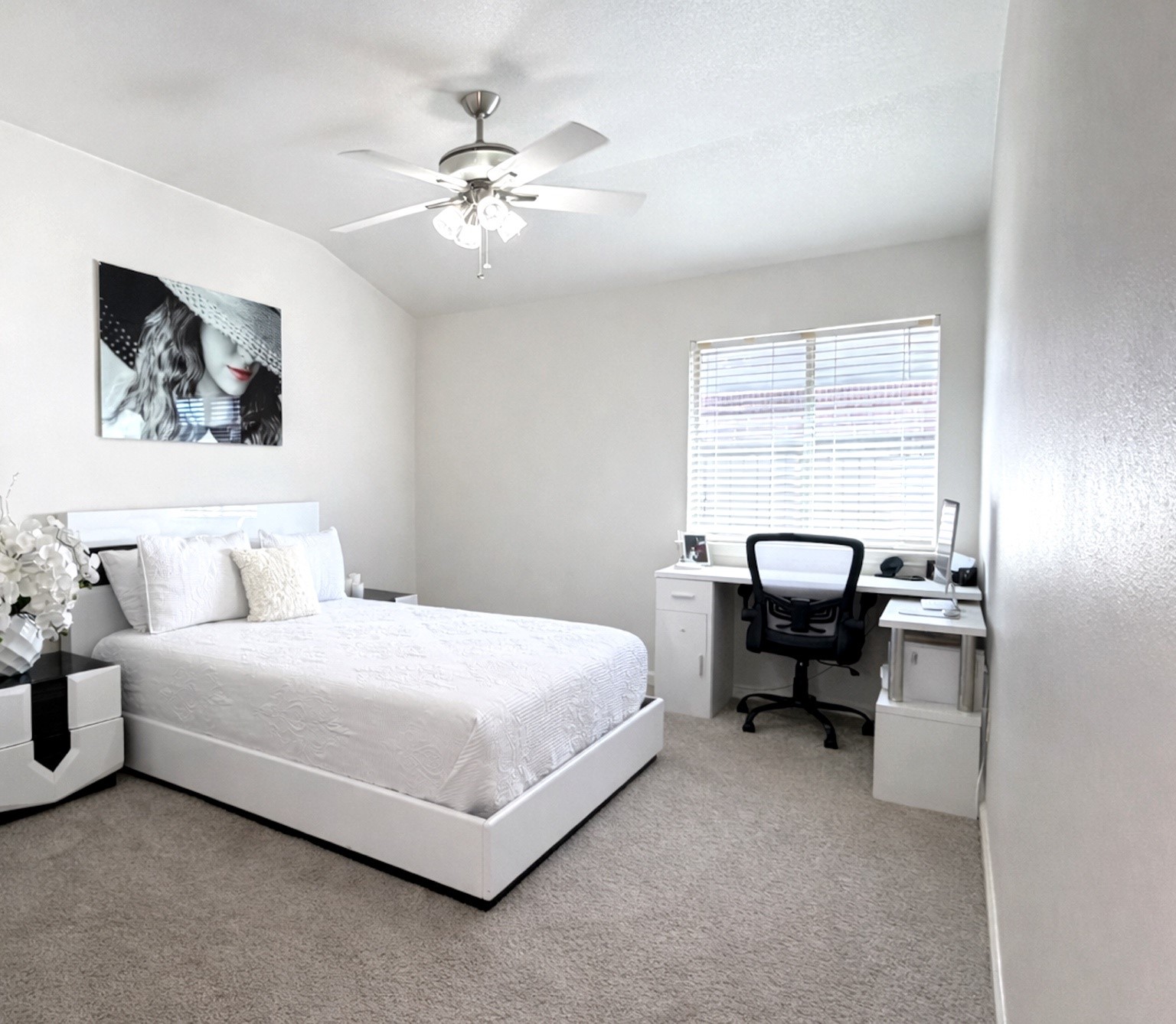 24534 Forest Path Court Spring, TX 77373 - Photo 32 of 43 a bedroom with a bed and a chandelier