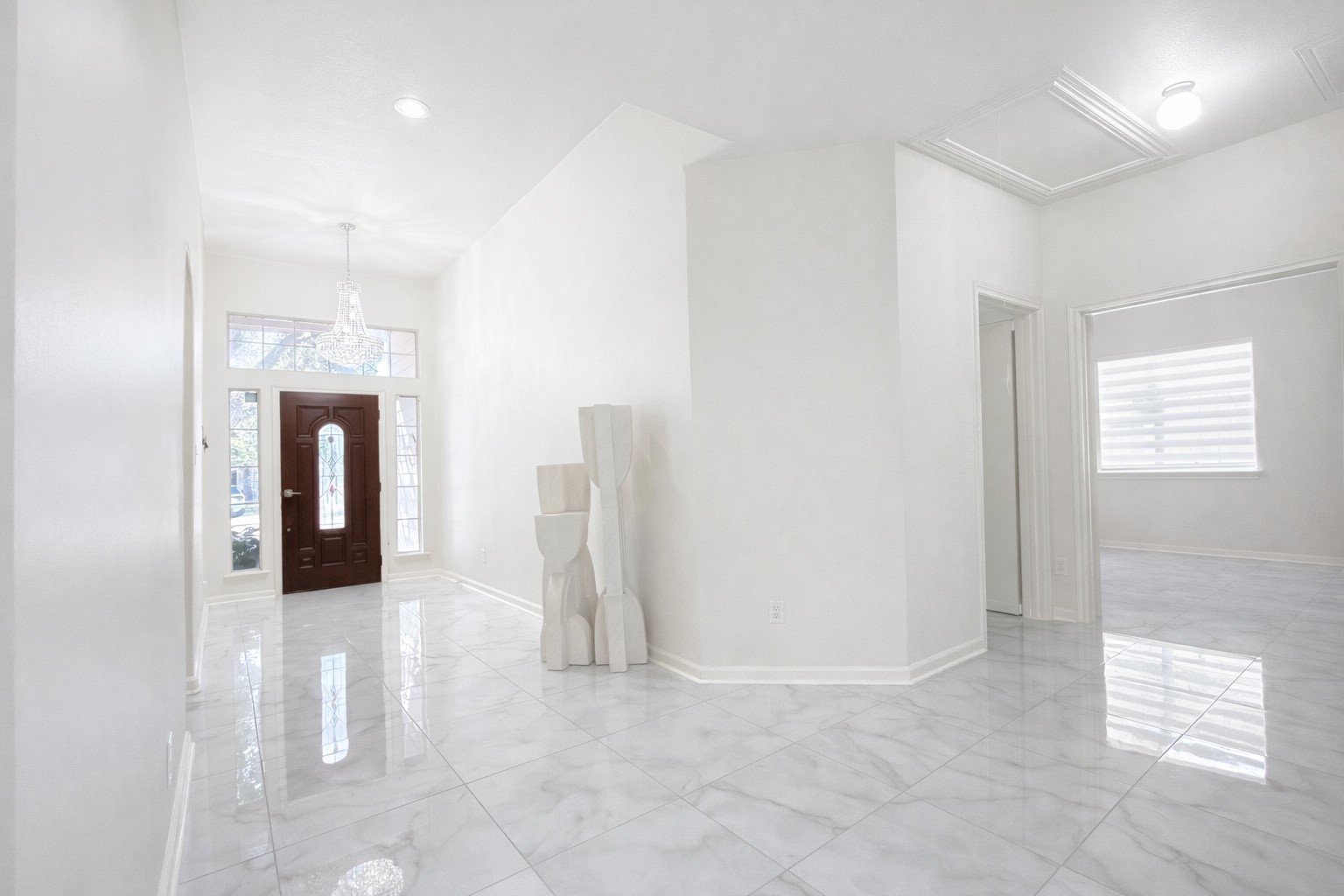24534 Forest Path Court Spring, TX 77373 - Photo 6 of 43 a view of a hallway with wooden floor and windows