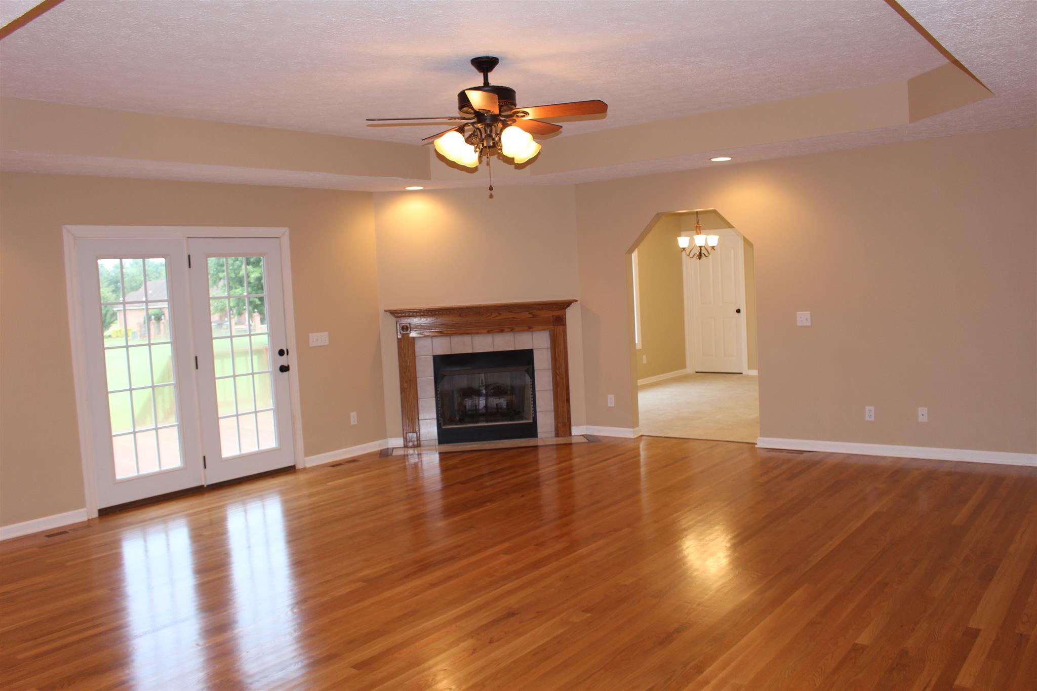 425 Brandon Road Manchester, TN 37355 - Photo 4 of 25 a view of an empty room with wooden floor and a window