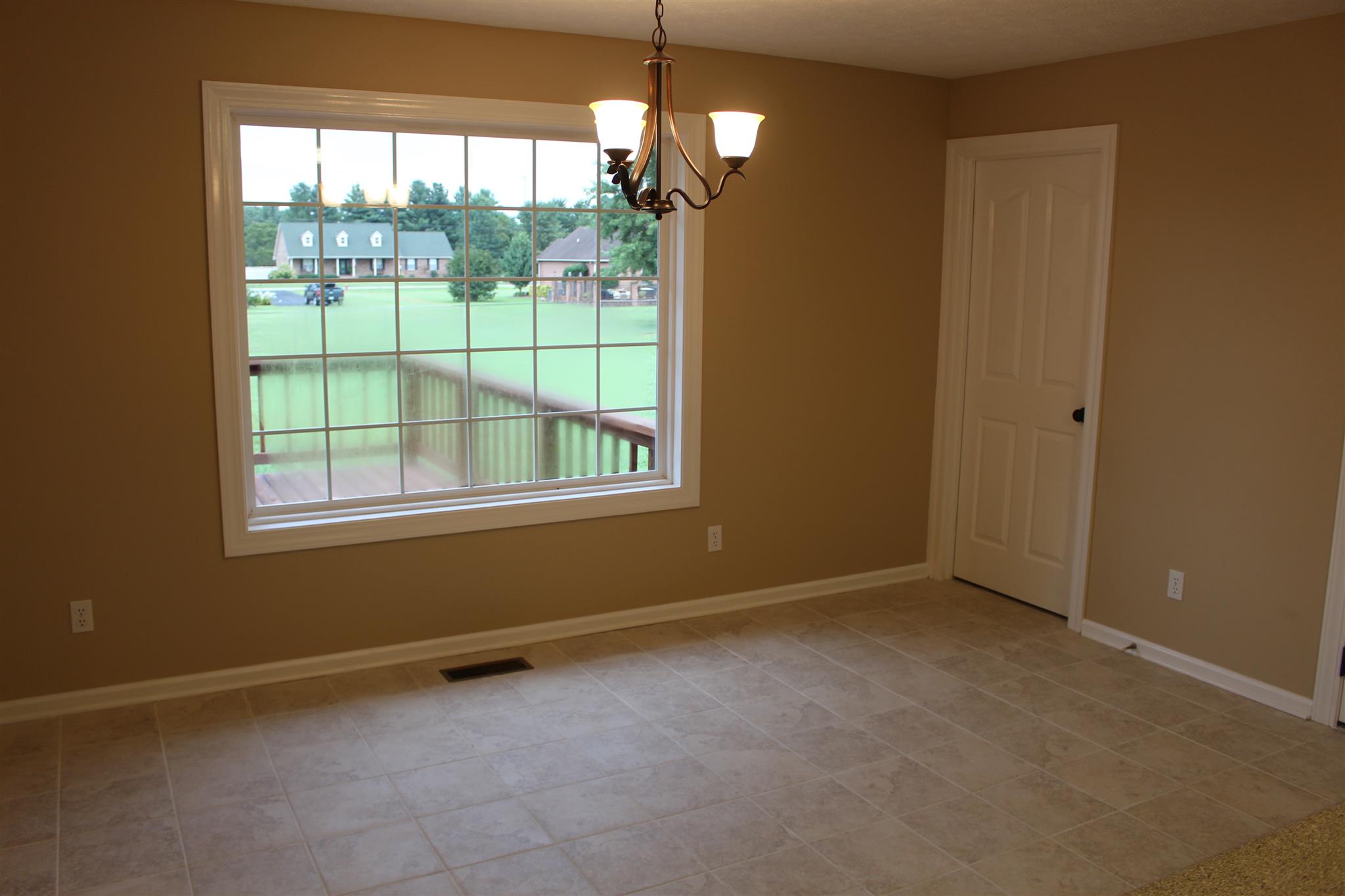 425 Brandon Road Manchester, TN 37355 - Photo 9 of 25 an empty room with windows and outdoor space