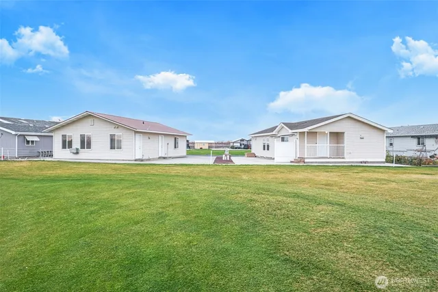 a front view of house with yard and seating area