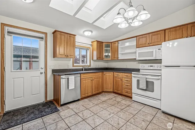 an empty room with wooden floor and closet