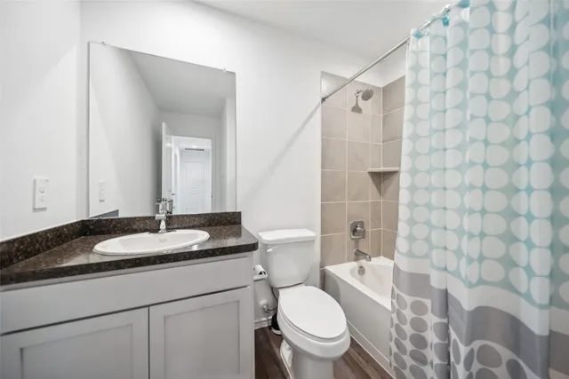 a view of a backyard with wooden fence