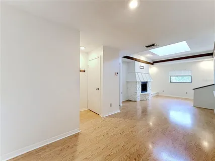 a view of a livingroom with wooden floor