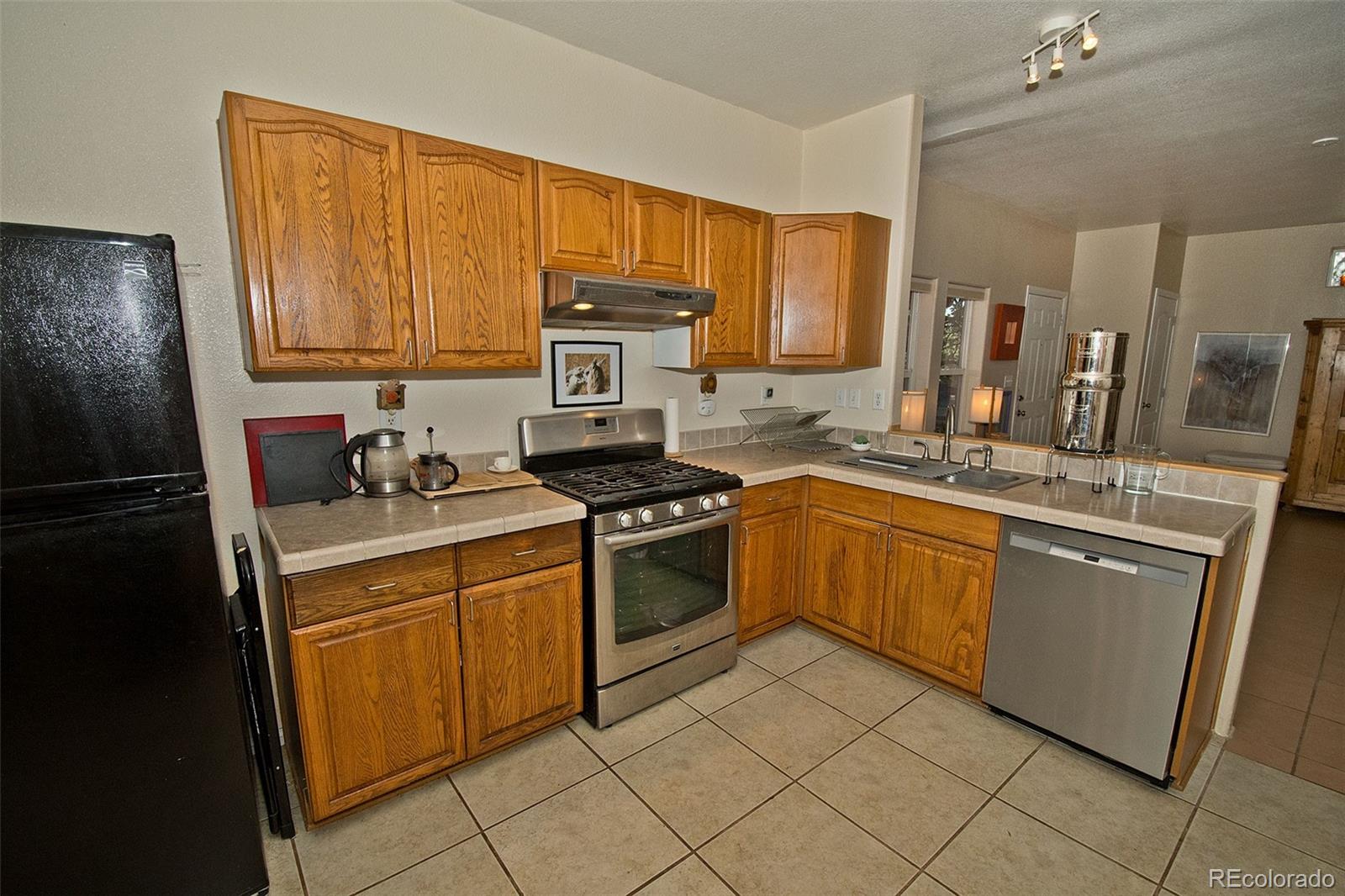 109 Pinewood Overlook Crestone, CO 81131 - Photo 11 of 35 a kitchen with a sink stove and cabinets
