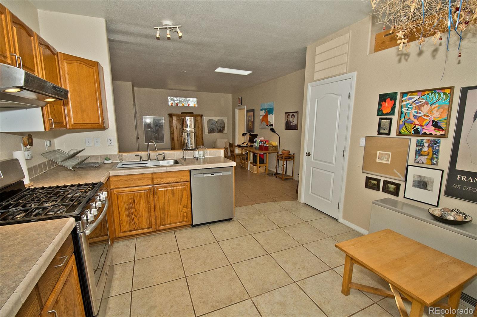 109 Pinewood Overlook Crestone, CO 81131 - Photo 12 of 35 a kitchen with stainless steel appliances a stove a sink and a refrigerator