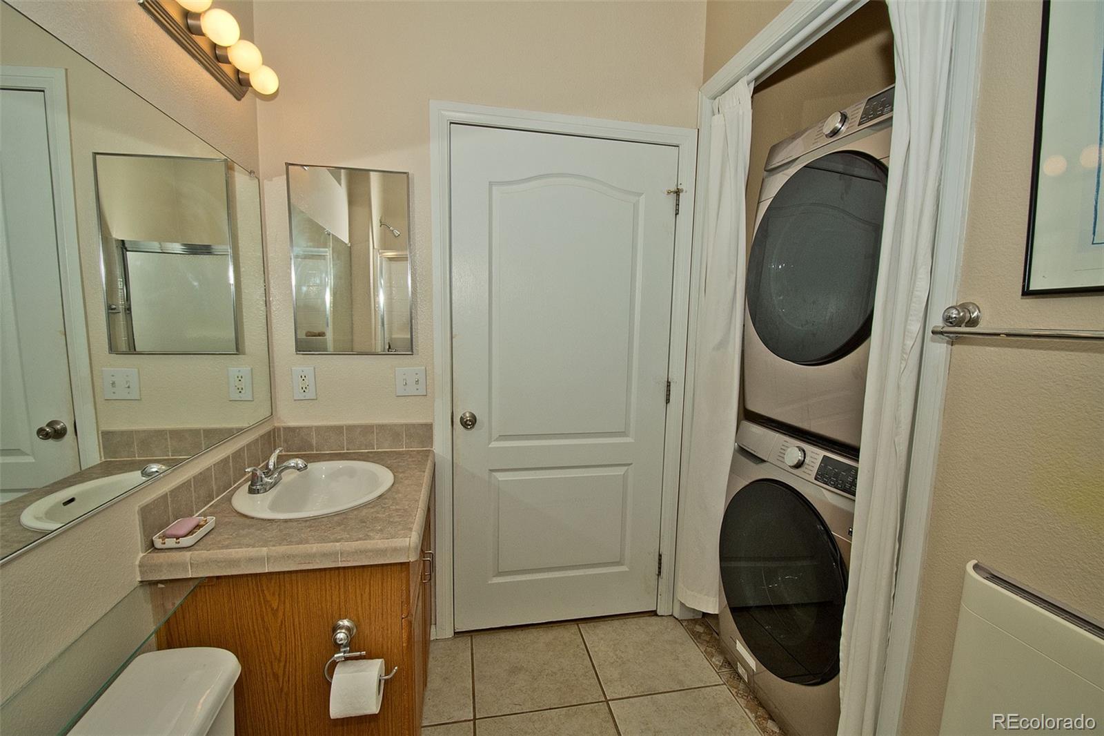 109 Pinewood Overlook Crestone, CO 81131 - Photo 19 of 35 a bathroom with a sink a washer and dryer