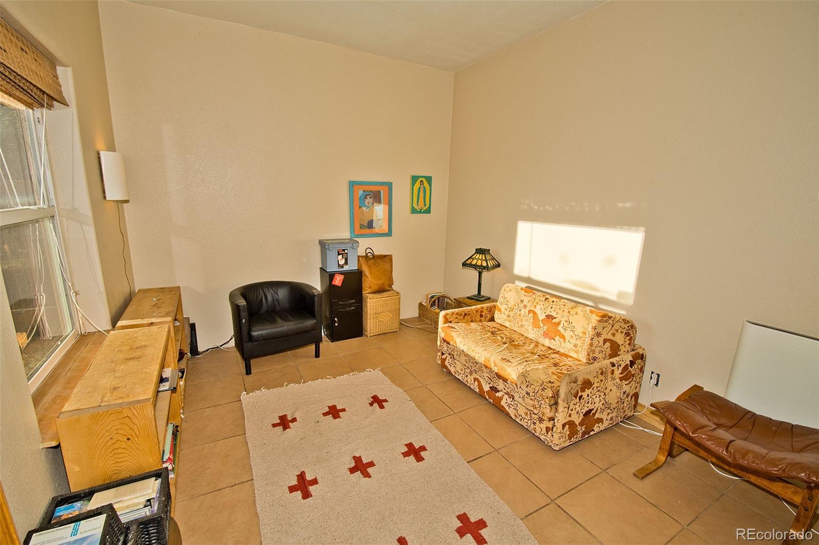 109 Pinewood Overlook Crestone, CO 81131 - Photo 20 of 35 a bedroom with furniture and a wooden floor