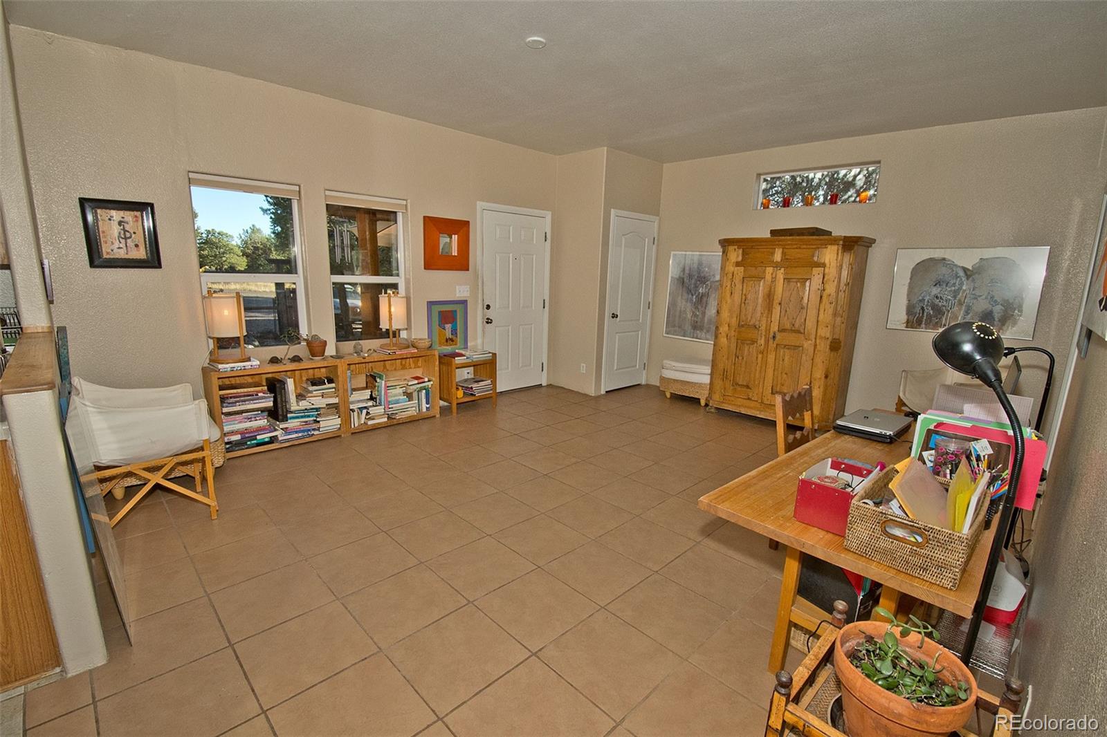 109 Pinewood Overlook Crestone, CO 81131 - Photo 8 of 35 a view of a workspace with furniture and toys