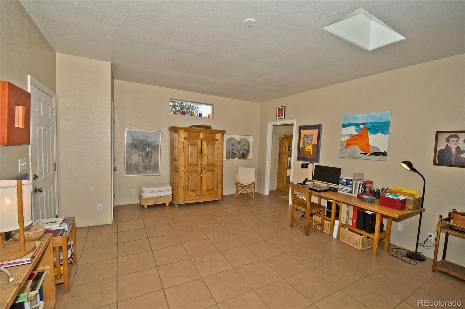 109 Pinewood Overlook Crestone, CO 81131 - Photo 9 of 35 a view of a livingroom with furniture and a flat screen tv