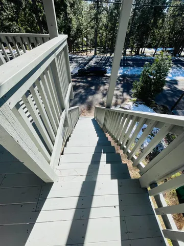 a view of balcony with furniture