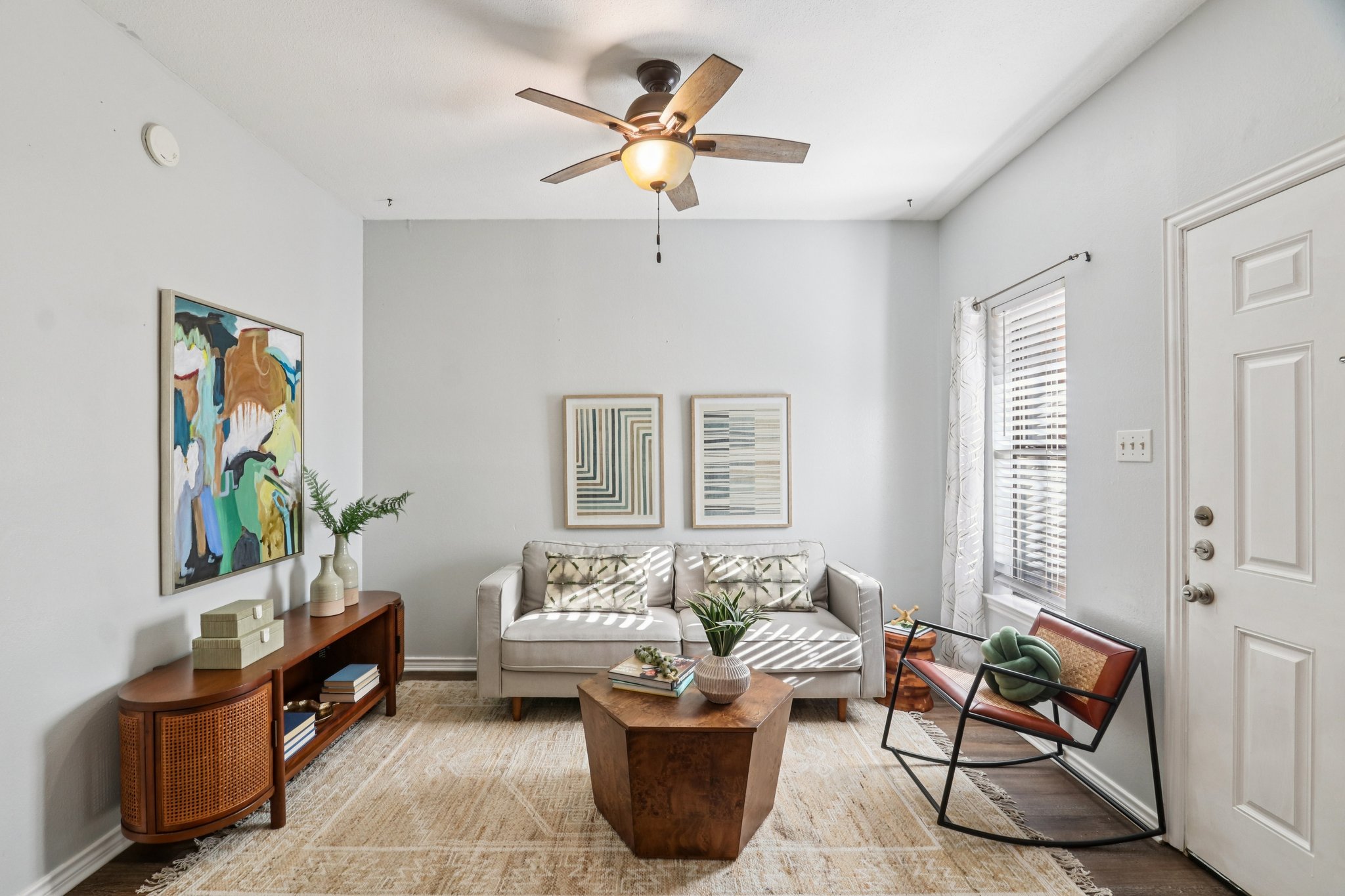 a living room with furniture and windows