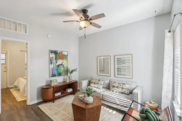 a living room with furniture and window