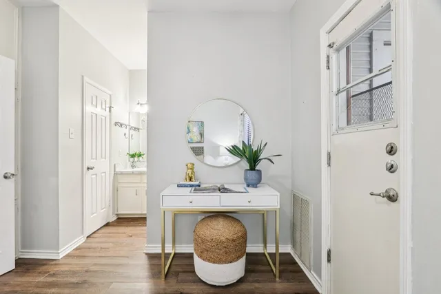 a bathroom with a sink vanity and a mirror