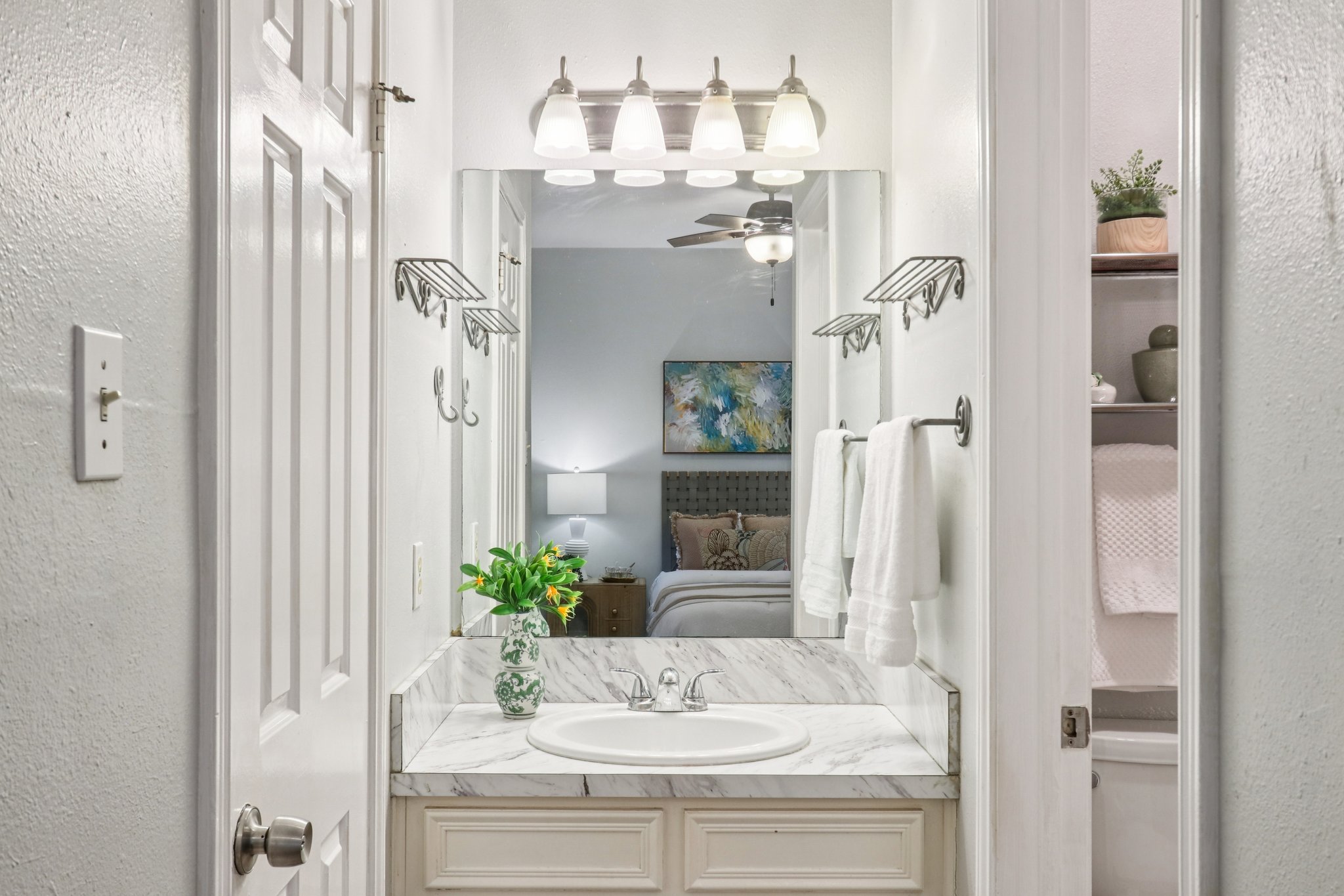 4401 Speedway, Unit 105 Austin, TX 78751 - Photo 31 of 38 a bathroom with a sink vanity and a mirror