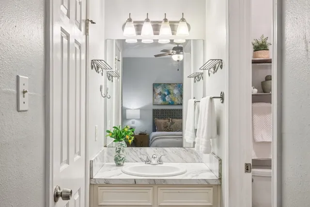 a bathroom with a toilet and shower