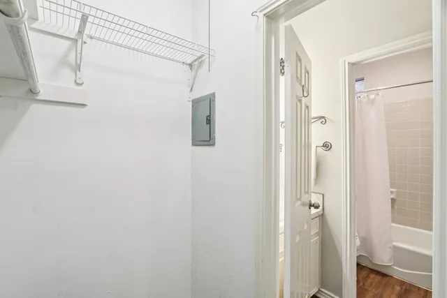 a view of a patio with a table and chairs