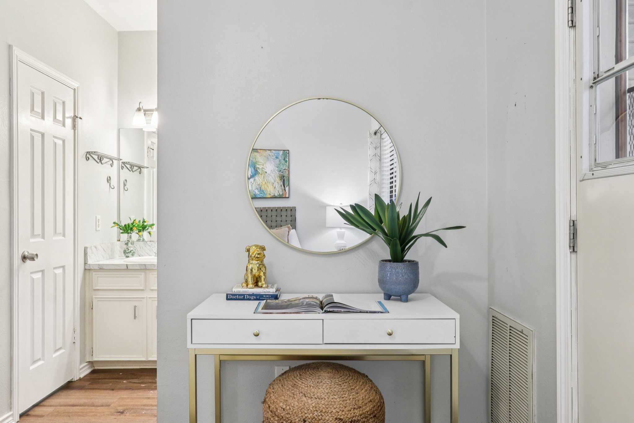 4401 Speedway, Unit 105 Austin, TX 78751 - Photo 5 of 38 a bathroom with a sink a mirror and a potted plant