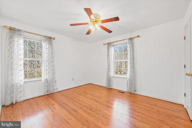 a view of a kitchen with a sink and a refrigerator