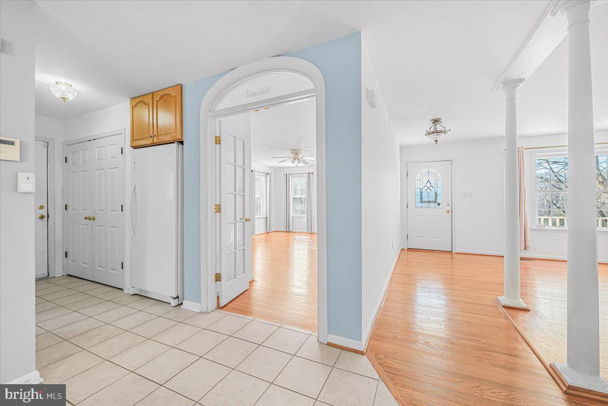 19626 Garretts Mill Road Knoxville, MD 21758 - Photo 21 of 38 a view of a hallway with wooden floor and a bathroom