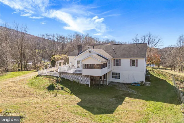 a view of a swimming pool with a yard