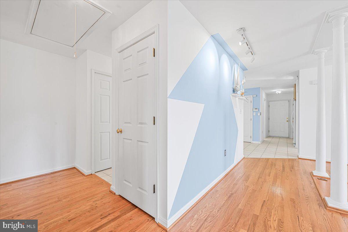 19626 Garretts Mill Road Knoxville, MD 21758 - Photo 7 of 38 a view of a hallway with wooden floor and staircase