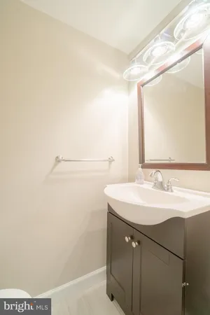 a bathroom with a sink a mirror and a shower