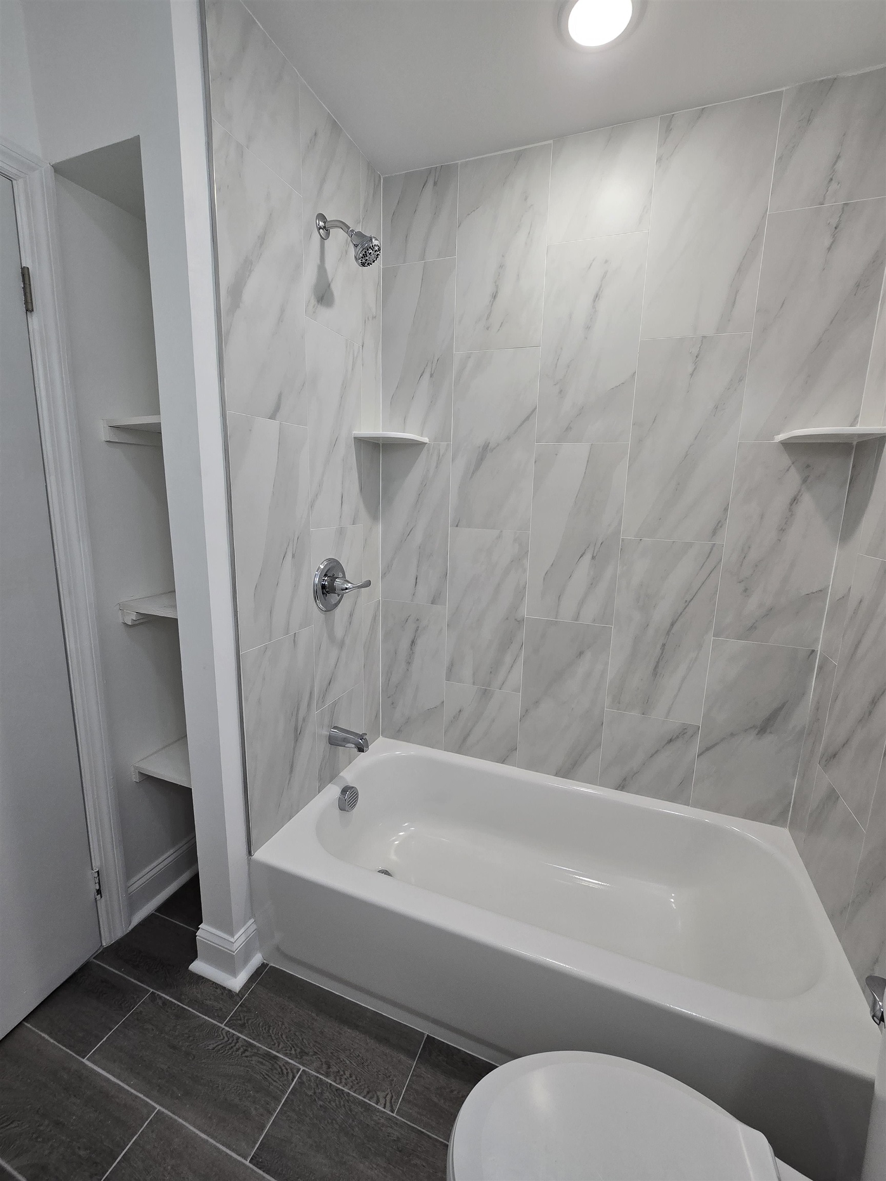 a bathroom with a bathtub and a shower