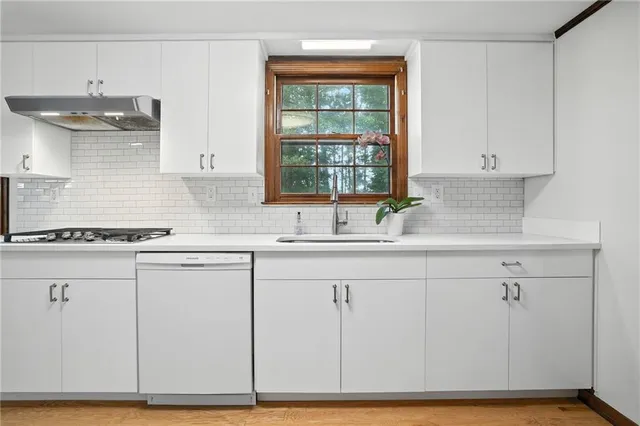 a view of a kitchen with cabinets