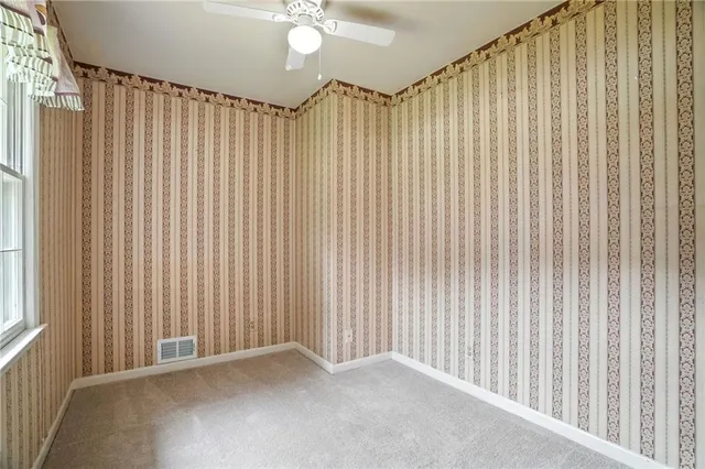 a bathroom with a sink toilet and mirror