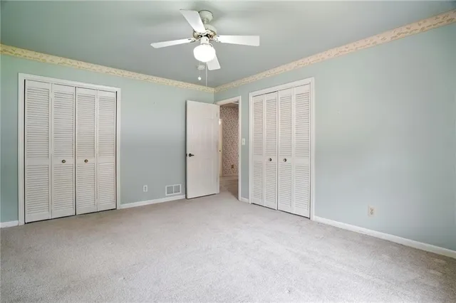 a bathroom with a granite countertop sink and a large mirror