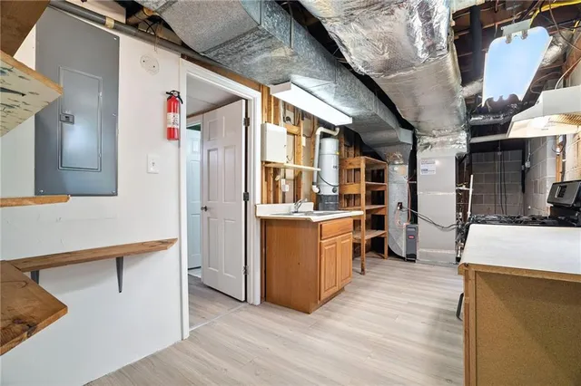 a view of an empty room with closet and workspace