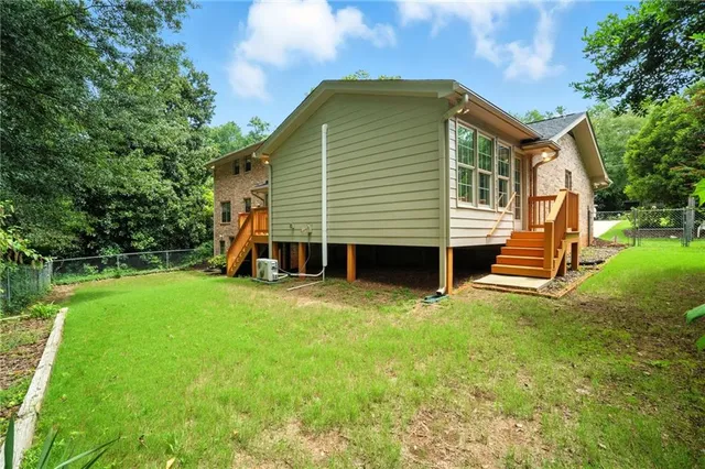 a front view of a house with a yard and porch