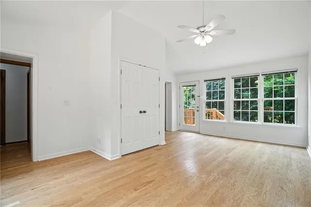 a view of an empty room with a window
