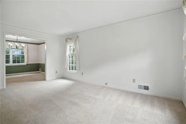 a bathroom with a granite countertop sink a toilet and a mirror