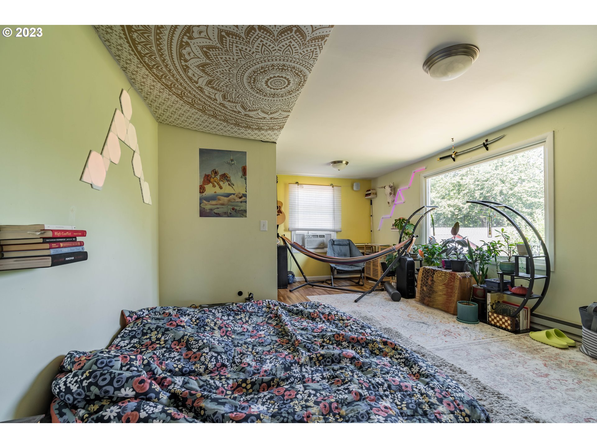 1275 West 5th Avenue Eugene, OR 97402 - Photo 17 of 31 a living room with furniture and a floor to ceiling window